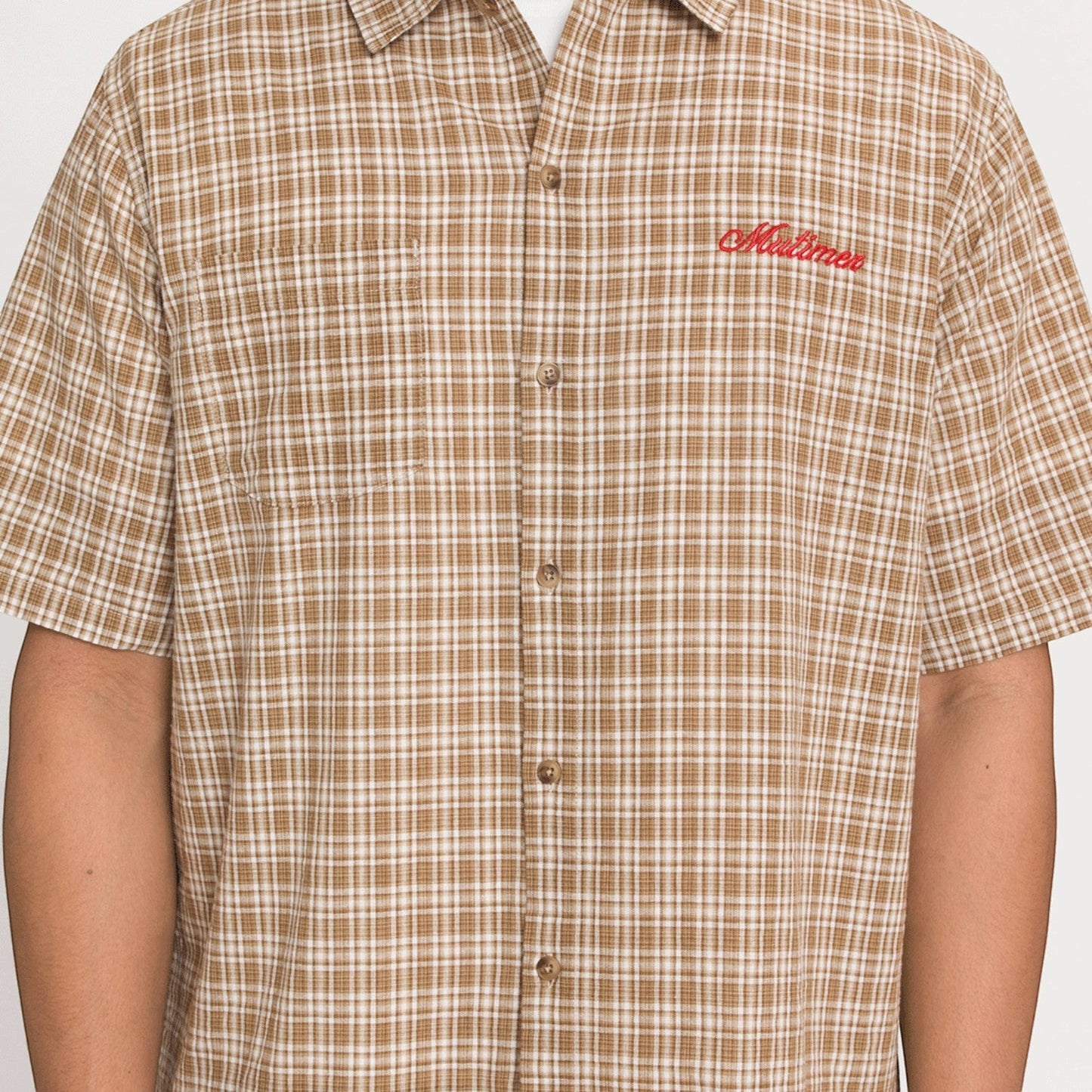 OFFCODE.USA brown and white plaid short-sleeve button-up shirt with red embroidered logo on chest.