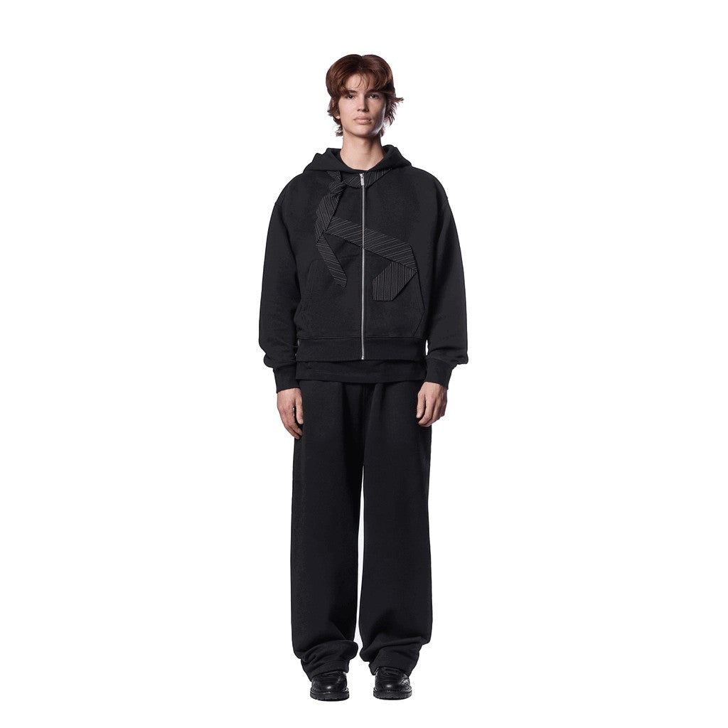 OFFCODE.USA black cotton zip-up hoodie with embroidered tie patch detail on front and back. Model wearing size L.
