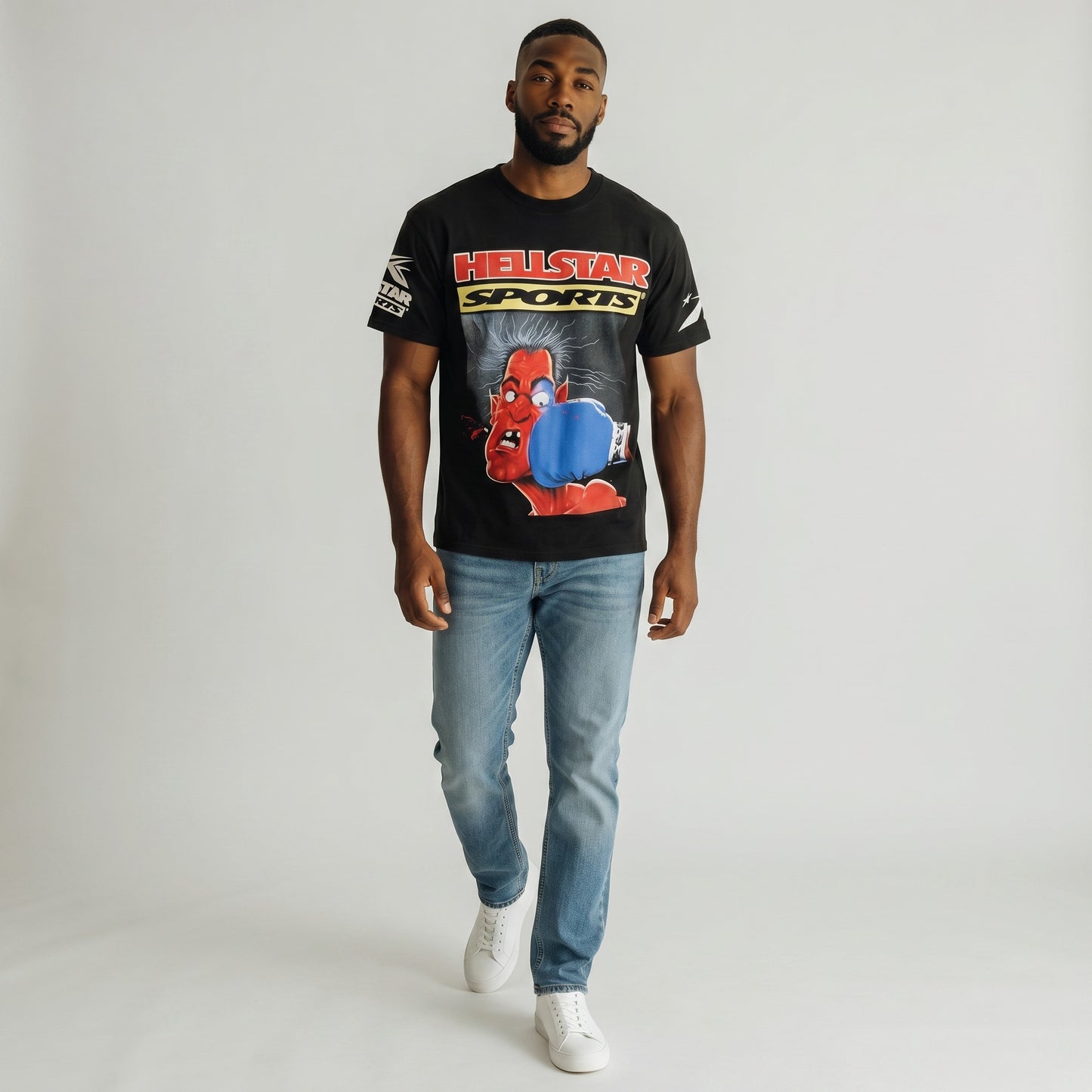 OFFCODE.USA black short-sleeved cotton t-shirt with a graphic print of a red devil being punched in the face by a blue boxing glove, with "HELLSTAR SPORTS" text.