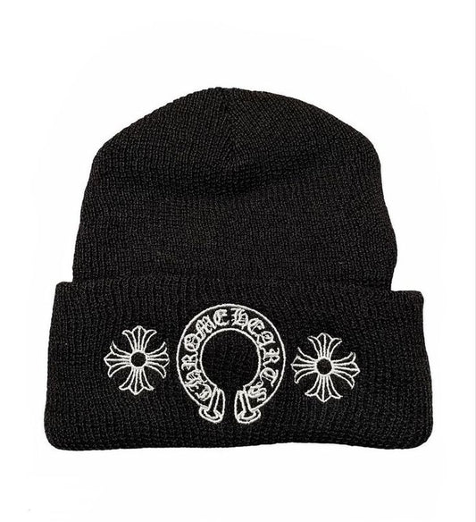 Black beanie with white embroidered design on a white background
