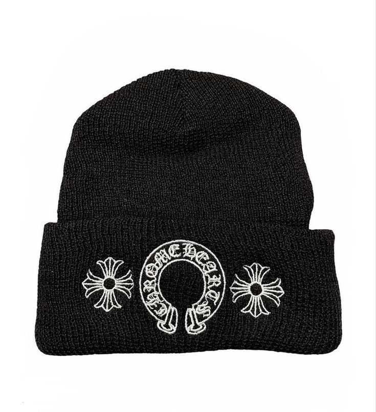 Black beanie with white embroidered design on a white background