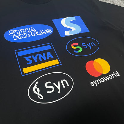 Close-up of six badge-style graphics on the front of a black T-shirt.