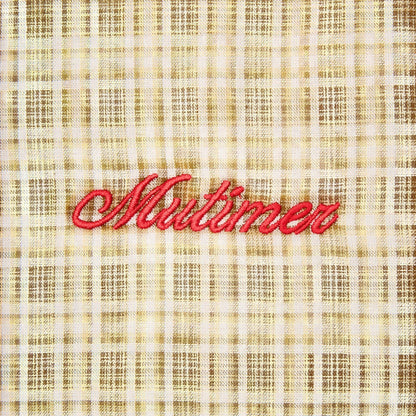 OFFCODE.USA Australiana Plaid Shirt with red embroidered 'Mutimer' logo on a gold and white checkered fabric.