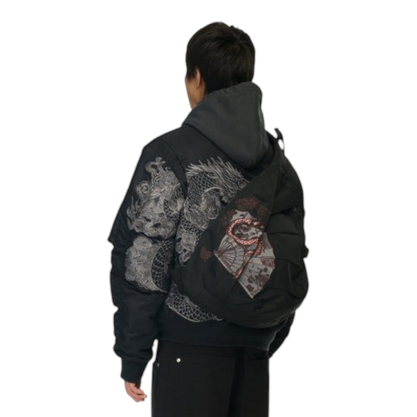 OFFCODE.USA black canvas yakuza sling bag with front embroidery and buckle detail worn by a model from behind