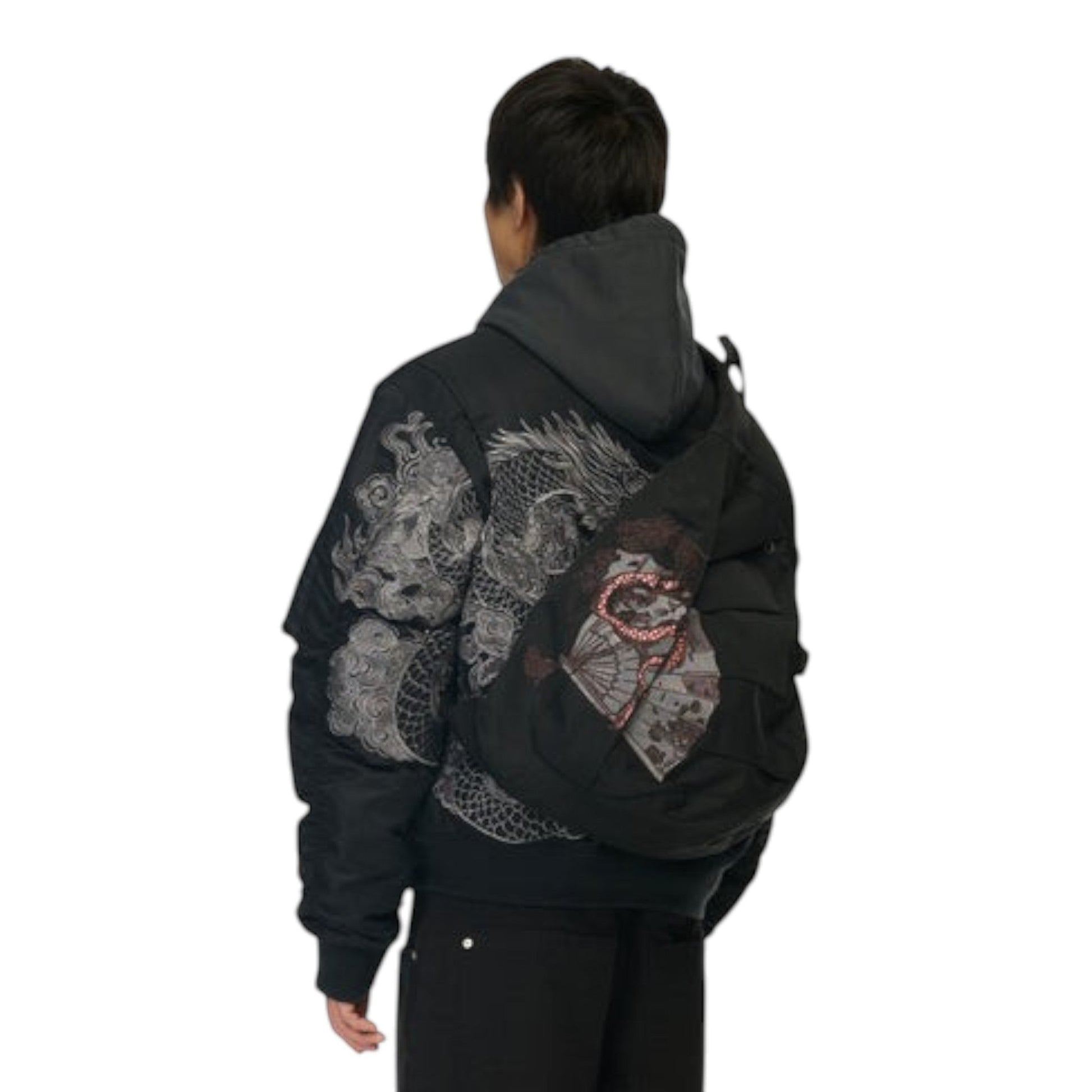 OFFCODE.USA black canvas yakuza sling bag with front embroidery and buckle detail worn by a model from behind
