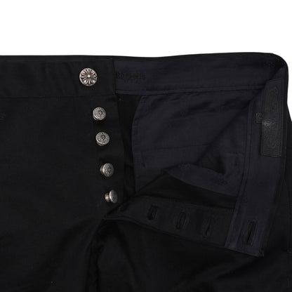 OFFCODE.USA black cotton chino pants with button fly and decorative silver buttons.