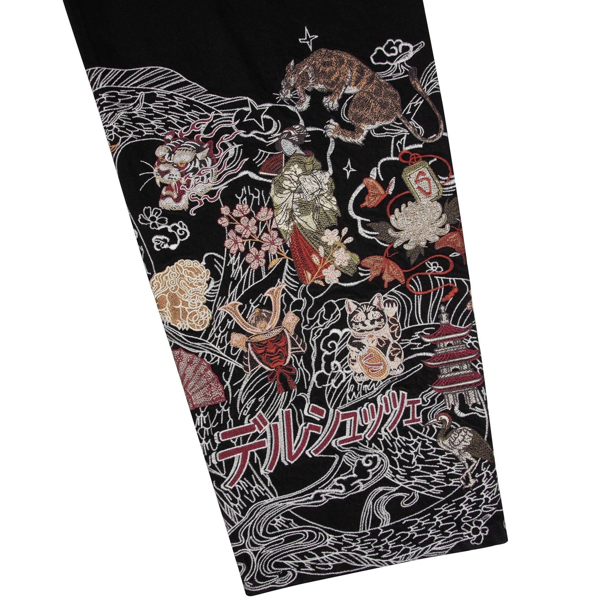OFFCODE.USA black denim jeans with intricate Japanese-style embroidery of dragons, tigers, samurai, and geishas. 100% cotton.