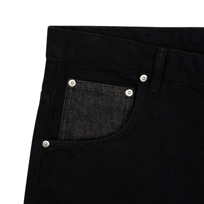 OFFCODE.USA black denim jeans with a raw denim coin pocket and balloon fit, made from 100% cotton.