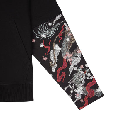 OFFCODE.USA black cotton hoodie with double sleeves featuring intricate dragon embroidery and cherry blossoms.