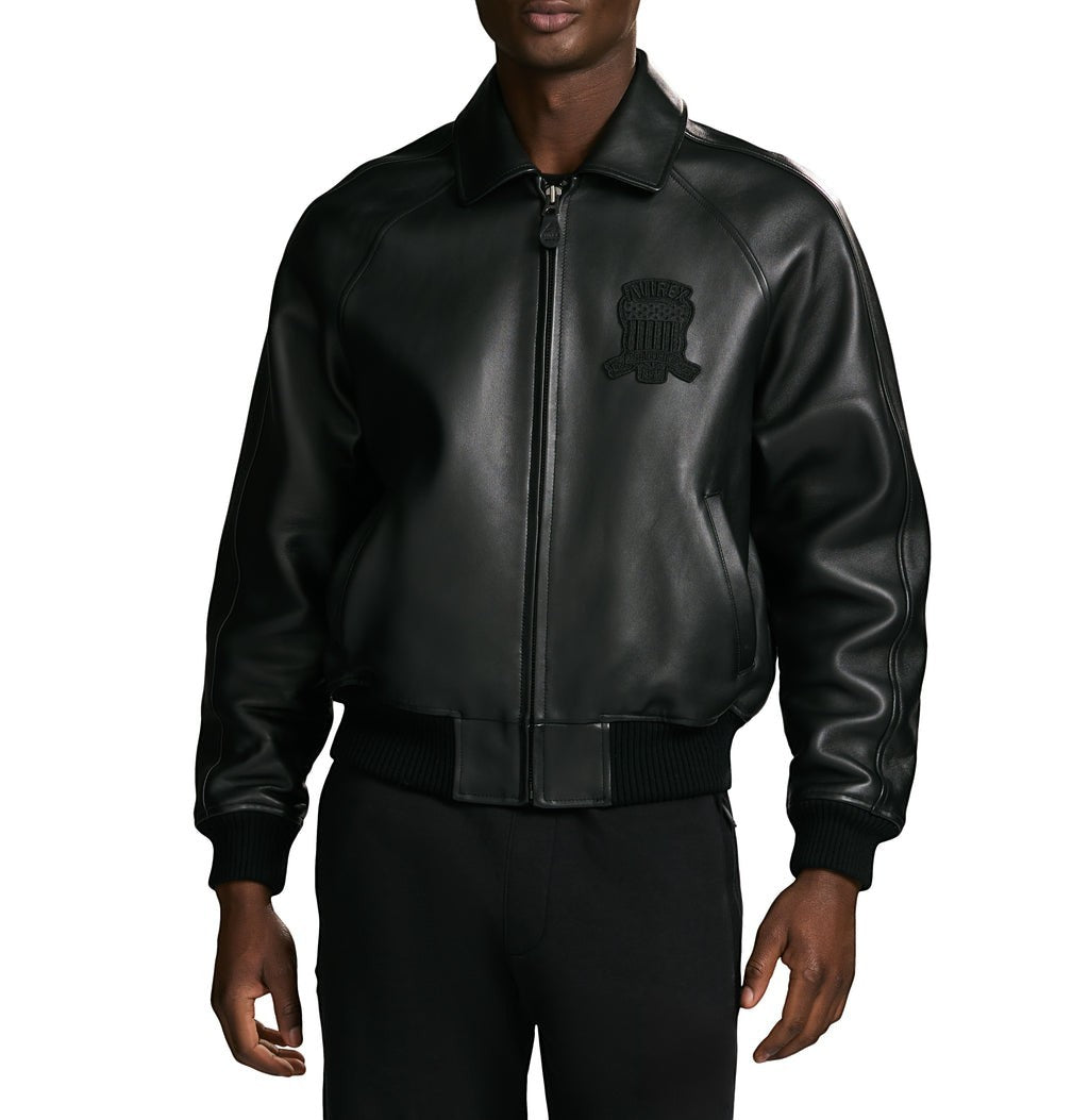OFFCODE.USA black antique lamb leather bomber jacket with logo details on chest, front zipper, and ribbed cuffs/hem.
