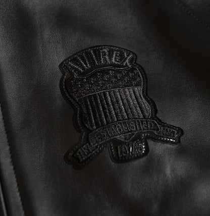 OFFCODE.USA black leather bomber jacket with embroidered Avirex logo patch and striped rib hem. 100% lamb leather.