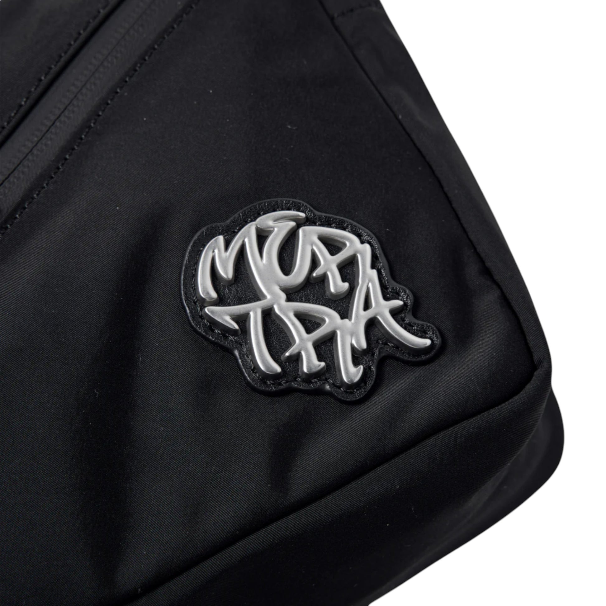 OFFCODE.USA black polyester side bag with adjustable strap, 5 pockets, and metal badge.