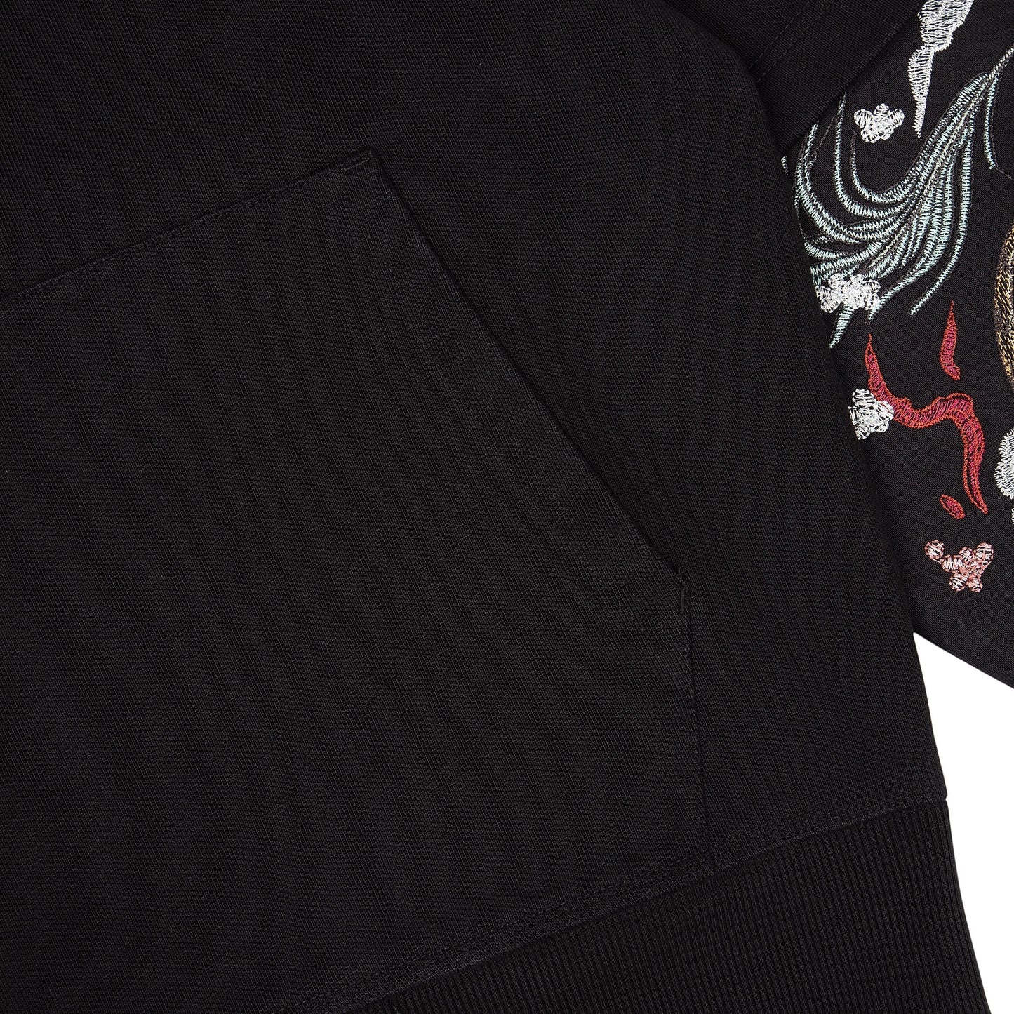 OFFCODE.USA black cotton hoodie with intricate "yakuza" embroidery on the sleeves. Features a front pocket and double sleeves.