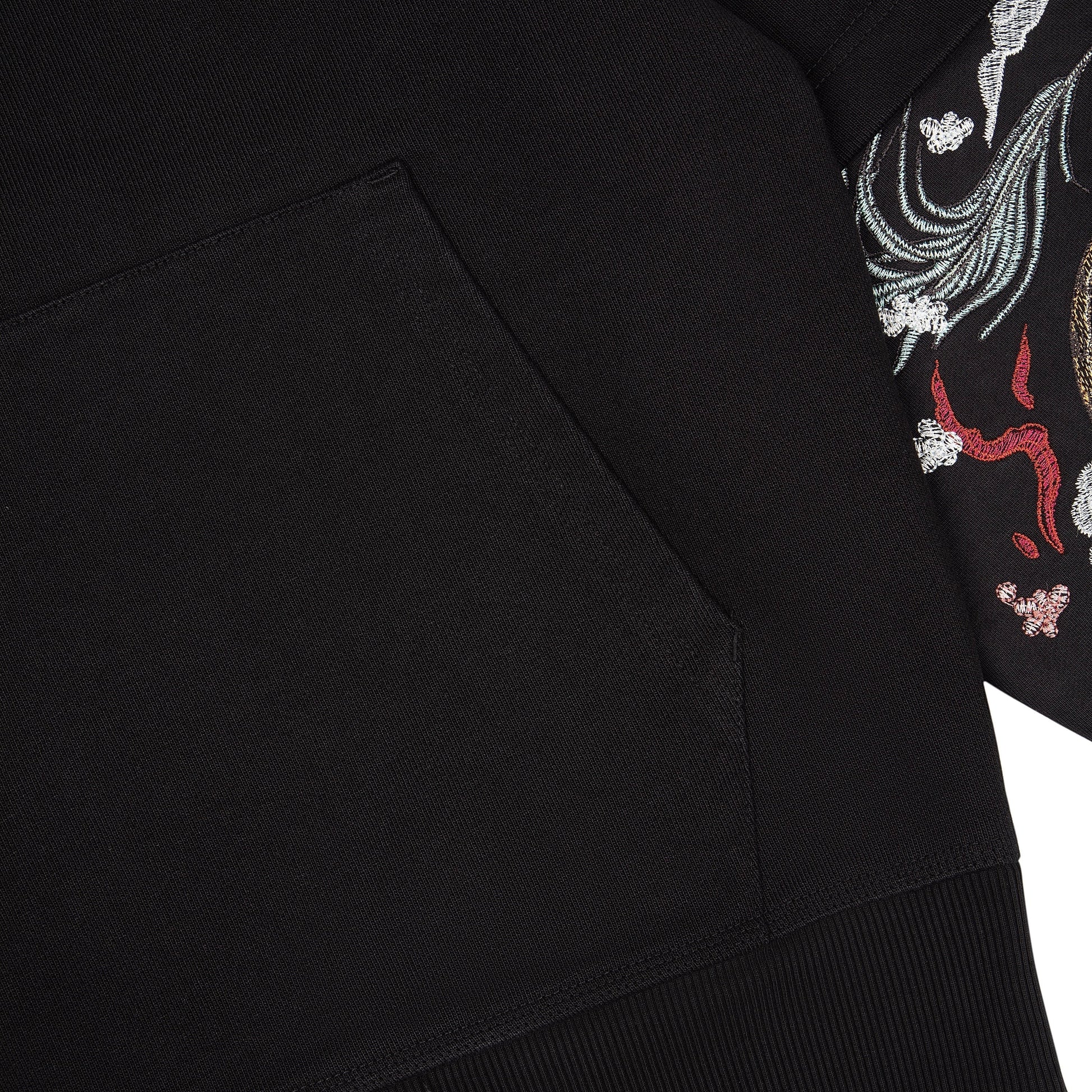 OFFCODE.USA black cotton hoodie with intricate "yakuza" embroidery on the sleeves. Features a front pocket and double sleeves.