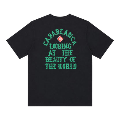 OFFCODE.USA black cotton t-shirt with green Casablanca "Looking at the Beauty of the World" graphic print.