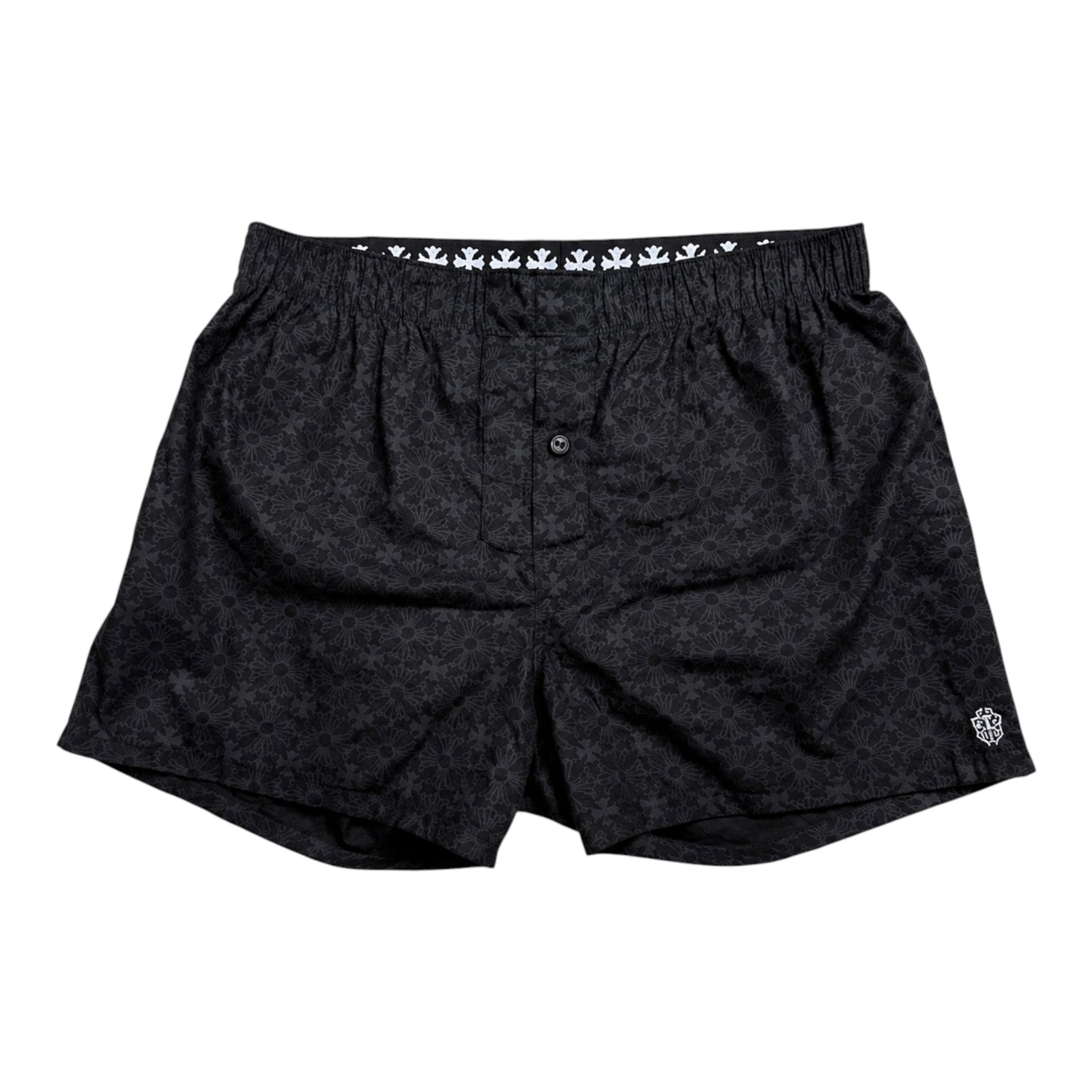 OFFCODE.USA black Chrome Hearts boxer brief shorts with a repeating floral pattern and white cross waistband detail.
