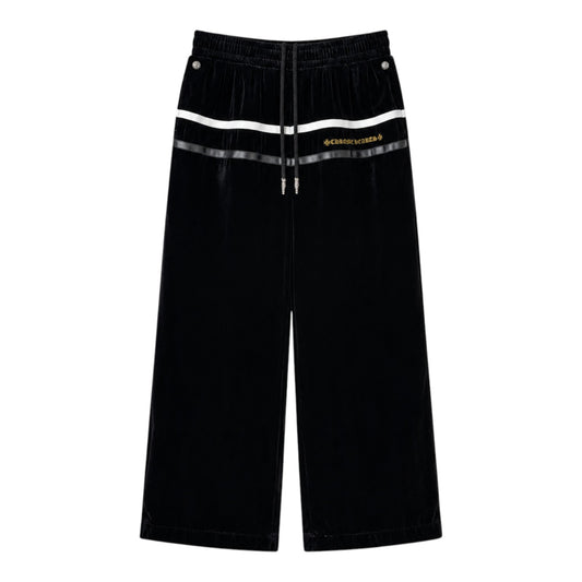 OFFCODE.USA Chrome Hearts So It Goes black velour track pants with white stripe detail and gold logo embroidery.