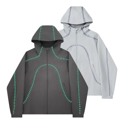 OFFCODE.USA dark grey 3L waterproof polyamide shell jacket with glow-in-the-dark seam taping and logos.