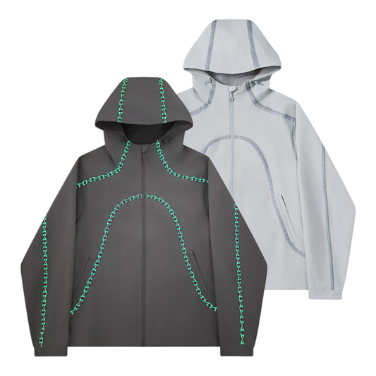 OFFCODE.USA dark grey 3L waterproof polyamide shell jacket with glow-in-the-dark seam taping and logos.