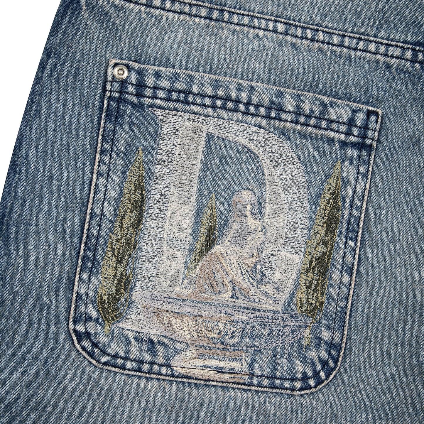 OFFCODE.USA gallery washed indigo denim jeans with embroidered back pocket featuring a statue and cypress trees.