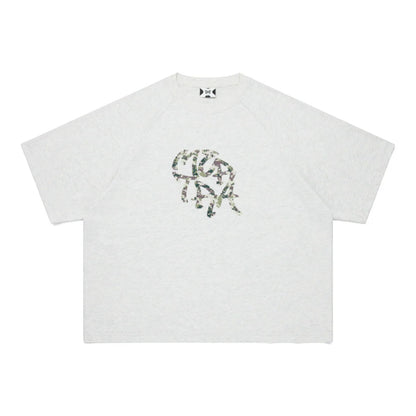 OFFCODE.USA Glitch Tee: light grey 100% cotton t-shirt with a camouflage graphic print and boxy, cropped fit.