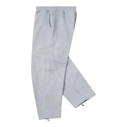 OFFCODE.USA grey cotton blend joggers with dual panelling, embroidered logo, and ankle toggles.