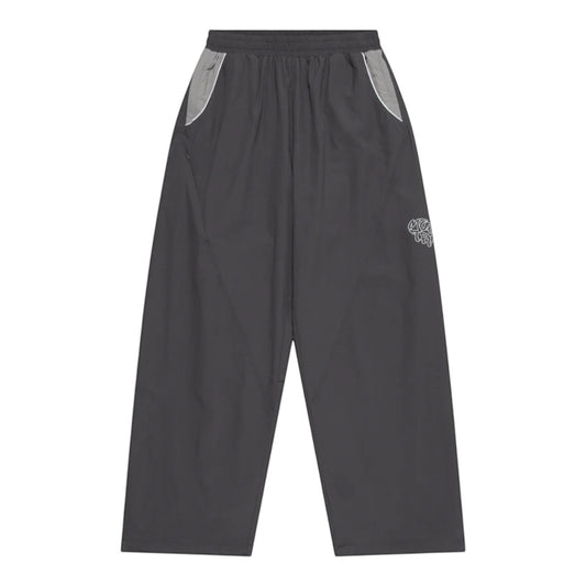 OFFCODE.USA grey nylon track pants with white 3D piping, applique mesh logo, and ankle toggles.