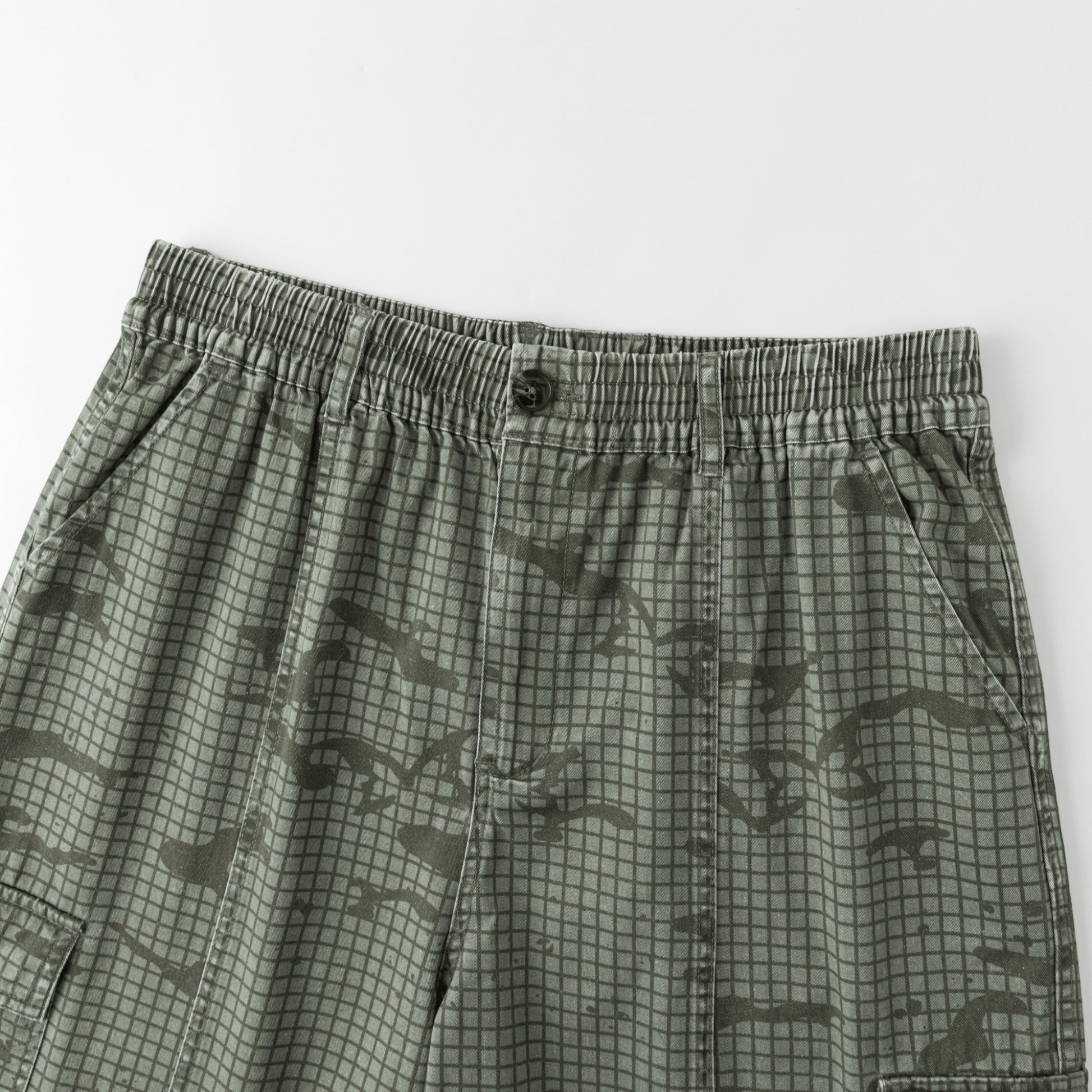 OFFCODE.USA Grid Camo Shorts in 100% cotton with a grid camo print, tortoise shell button, and YKK fly zipper.