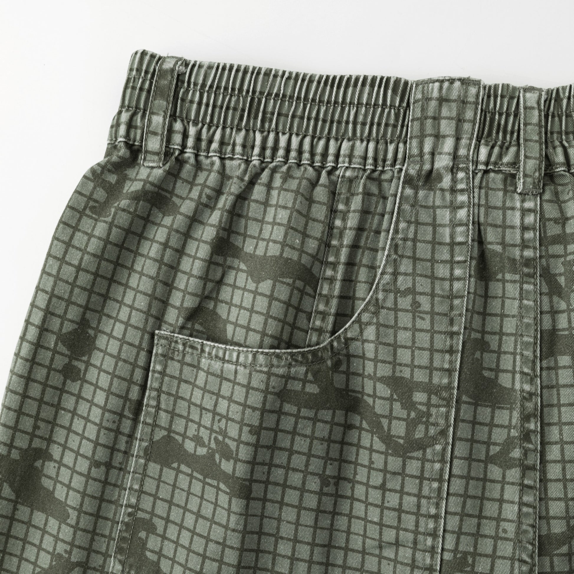 OFFCODE.USA Grid Camo Shorts in green cotton with a baggy, wide-leg fit and signature back pocket.