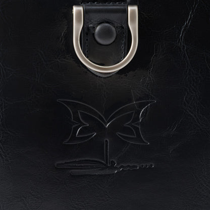 OFFCODE.USA MERTRA x Slawn Duffle bag in black PU leather with debossed butterfly graphic and metal hardware.
