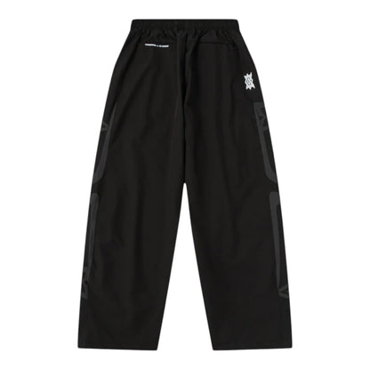 OFFCODE.USA MERTRA x Umbro Technical Bottoms in black with grey graphic details on the sides.