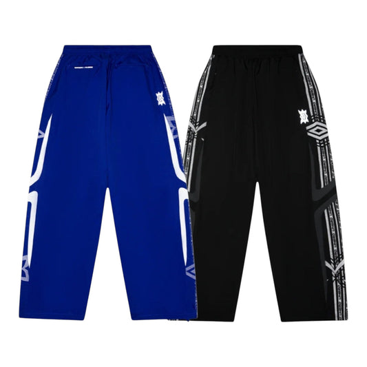 OFFCODE.USA MERTRA x Umbro technical track pants in blue and black with graphic side stripes and logos.