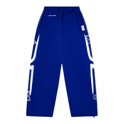 OFFCODE.USA MERTRA x Umbro technical track pants in royal blue with white graphic accents on the sides and black waistband.