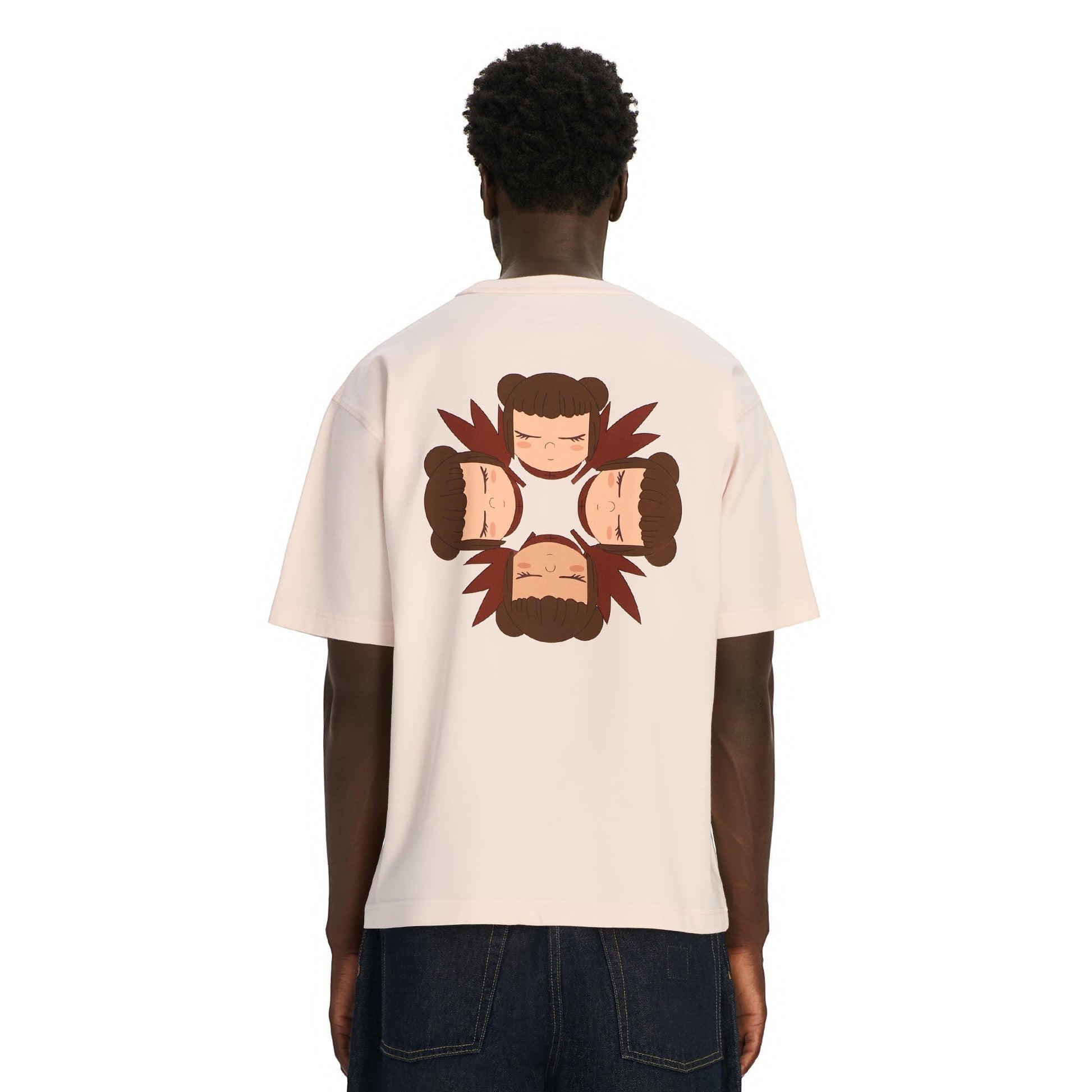 OFFCODE.USA pink 100% cotton t-shirt with graphic print of four faces on back. Model wears size L.