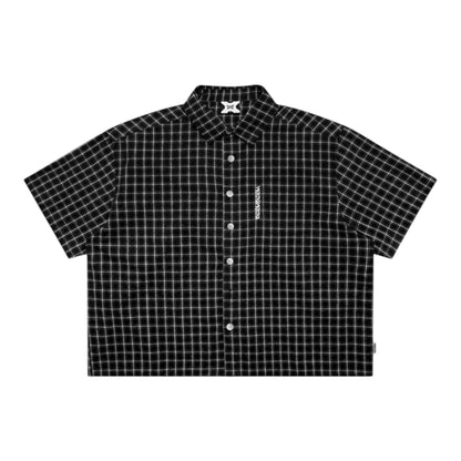 OFFCODE.USA black and white plaid 100% cotton short-sleeve shirt with embroidered graphic and tortoise shell buttons.