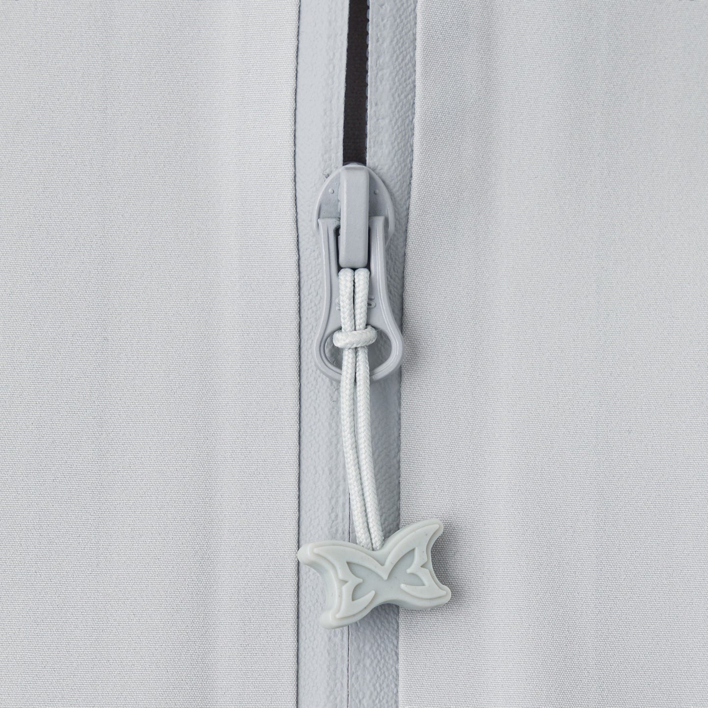 OFFCODE.USA light grey polyamide shell jacket with glow-in-the-dark taped seams and butterfly zipper pull.