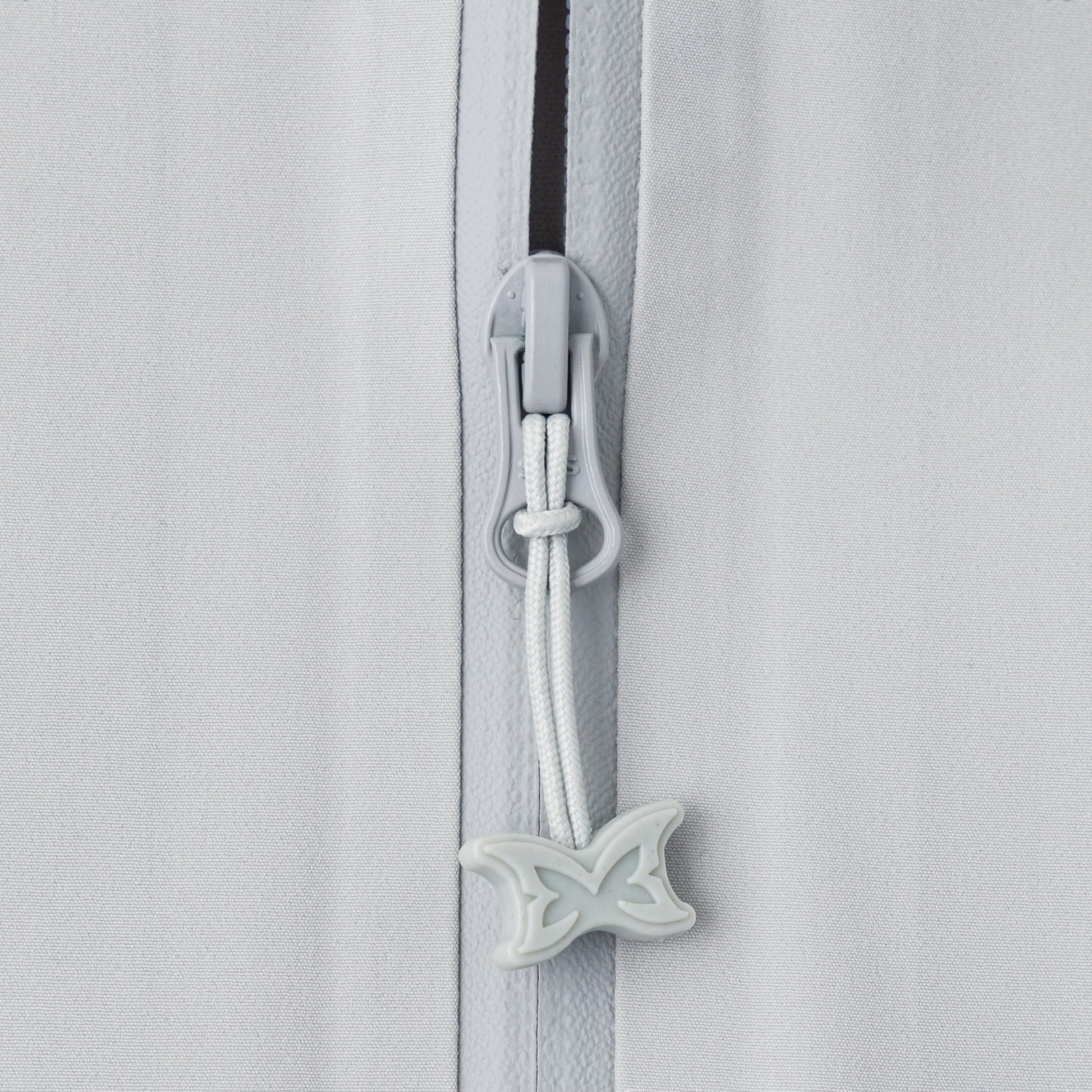 OFFCODE.USA light grey polyamide shell jacket with glow-in-the-dark taped seams and butterfly zipper pull.