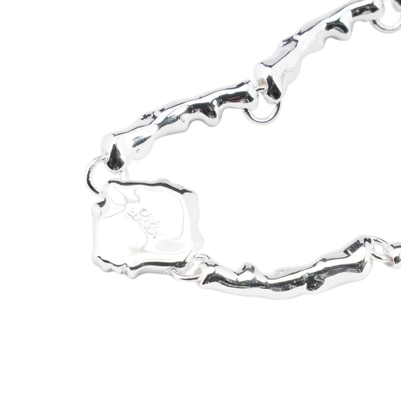 OFFCODE.USA silver and gold plated brass splash bracelet with unique organic links and a charm.