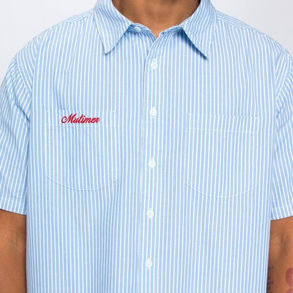 OFFCODE.USA light blue and white striped short-sleeve work shirt with red 'Mutimer' embroidery and two chest pockets.