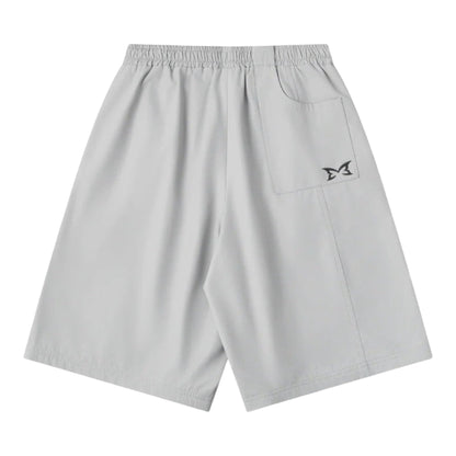 OFFCODE.USA light grey poly tech shorts with mesh lining, interior drawcord, and signature panelling. Baggy fit.