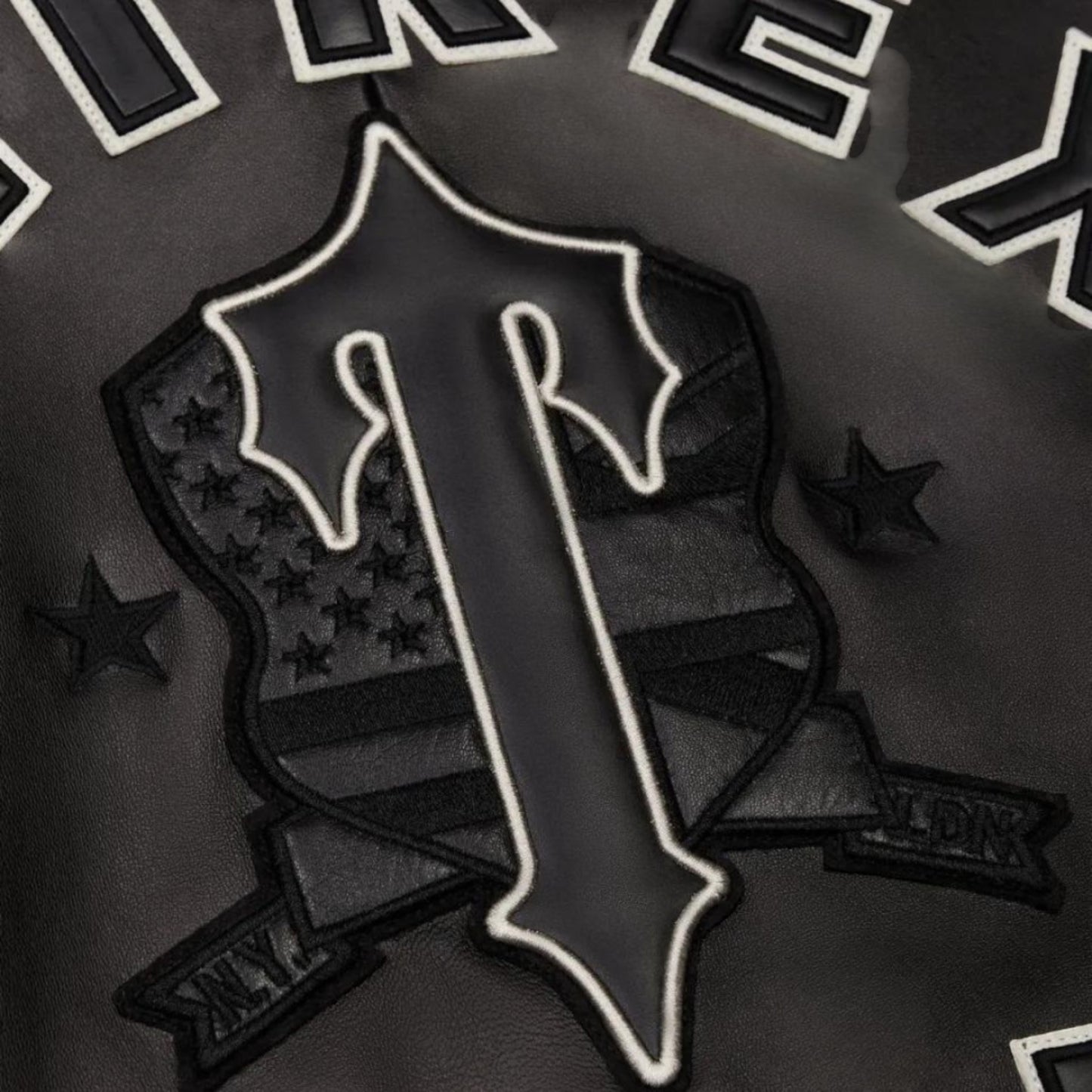 OFFCODE.USA black leather jacket with Trapstar X Avirex Icon logo, shield, stars, and ribbon details.