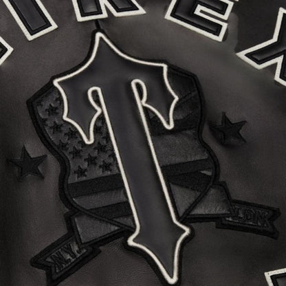 OFFCODE.USA black leather jacket with Trapstar X Avirex Icon logo, shield, stars, and ribbon details.