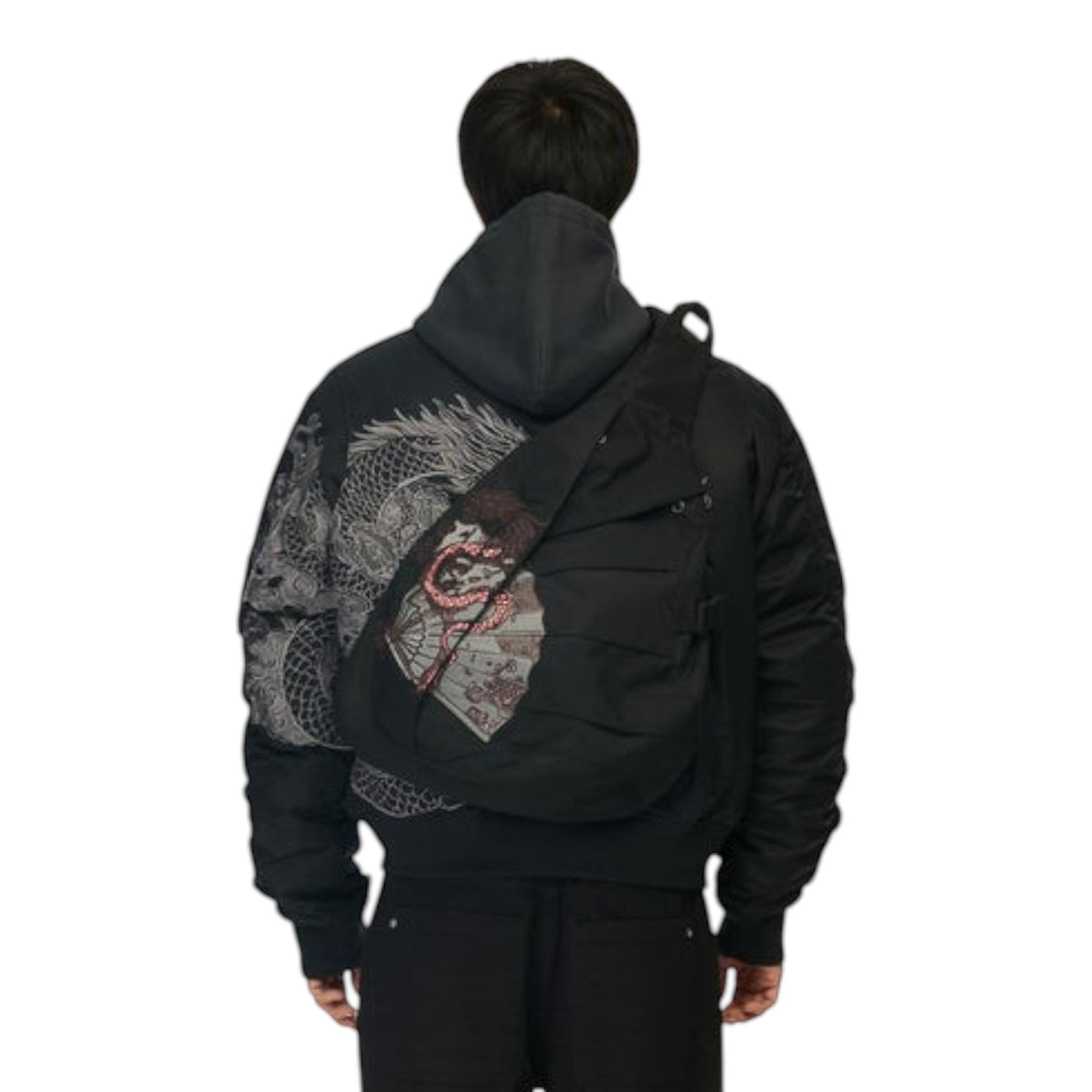 OFFCODE.USA black canvas yakuza sling bag with front embroidery, buckle closure, and adjustable strap worn on back