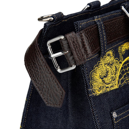 OFFCODE.USA yakuza v2 indigo raw denim handbag with brown leather belt detail, silver buckle, and yellow embroidery.