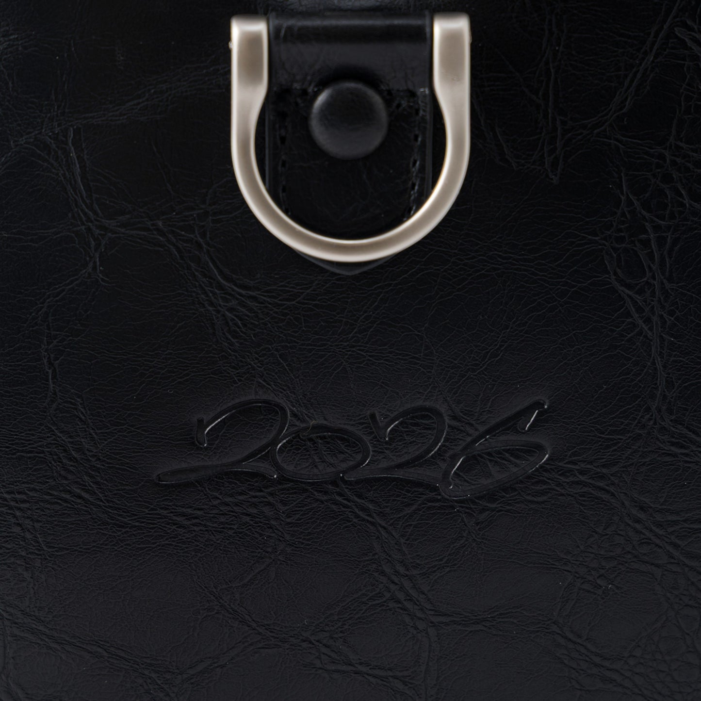 OFFCODE.USA MERTRA x Slawn Duffle bag in black PU leather with debossed graphics and metal hardware.