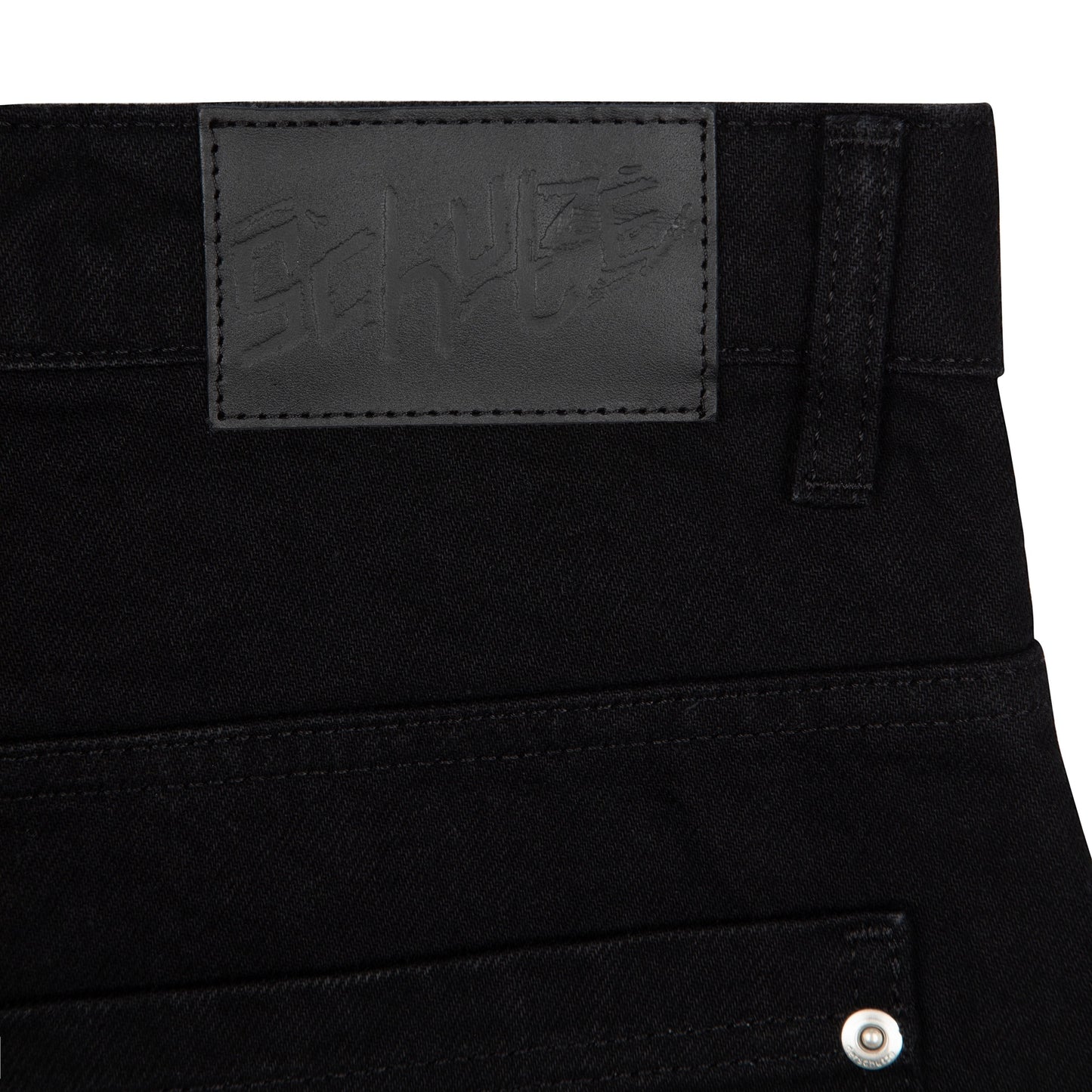 OFFCODE.USA black denim jeans with balloon fit, 100% cotton, featuring a black leather patch with embossed logo.