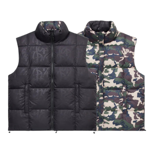 OFFCODE.USA reversible puffer vest with black monogram on one side and camo print on the other. Nylon and polyester shell with down fill.