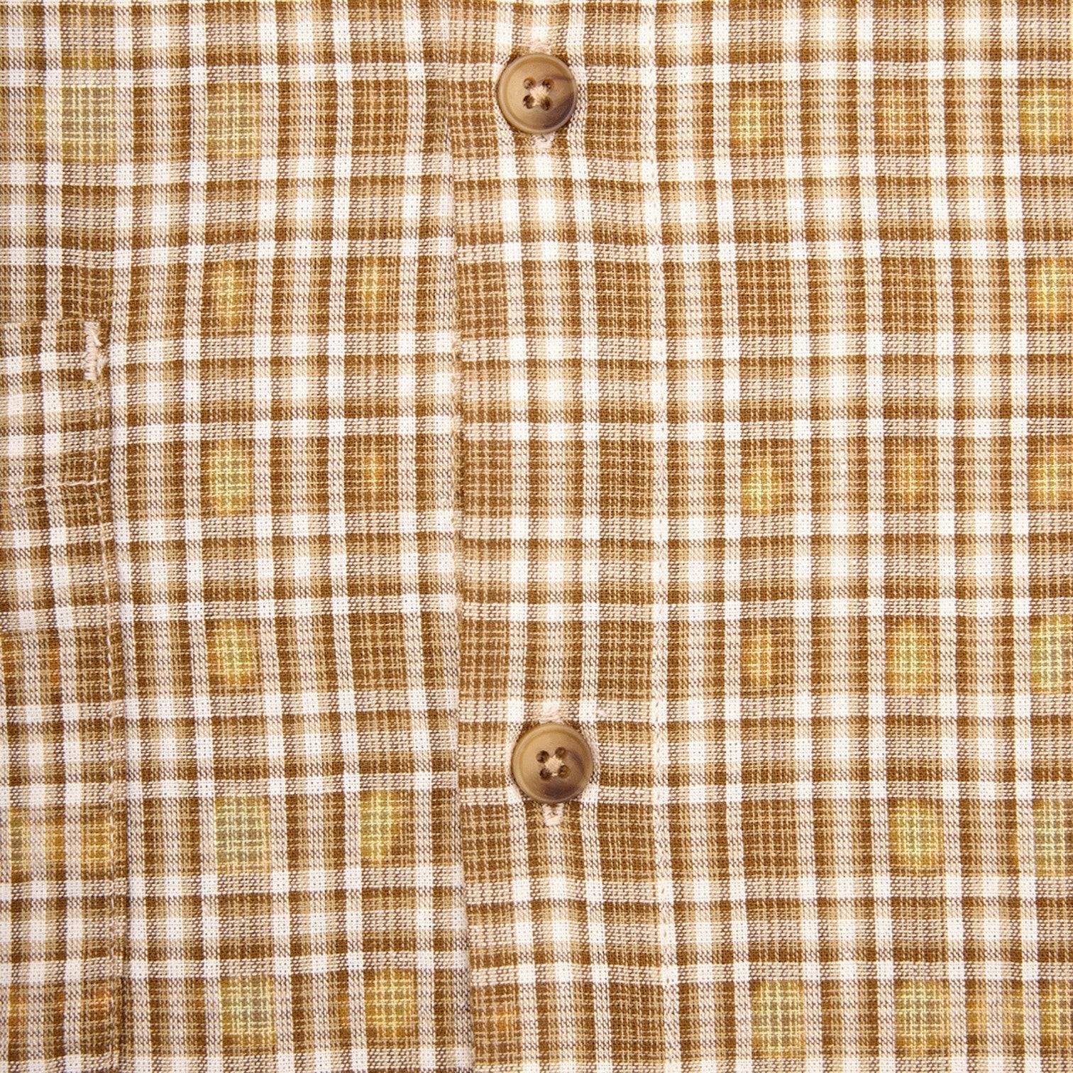 OFFCODE.USA Australiana Plaid Shirt in brown and white plaid pattern with two button closures.