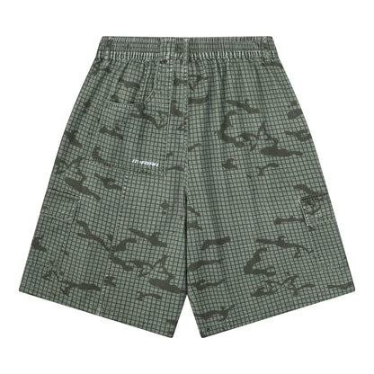 OFFCODE.USA Grid Camo Shorts in green and black, 100% cotton with a baggy fit and signature back pocket.