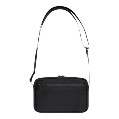 OFFCODE.USA black polyester side bag with adjustable strap, 5 pockets, leather/metal badge, camo lining, and waterproof zippers.